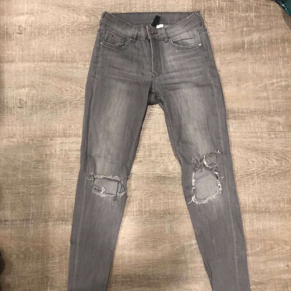 grey ripped jeans